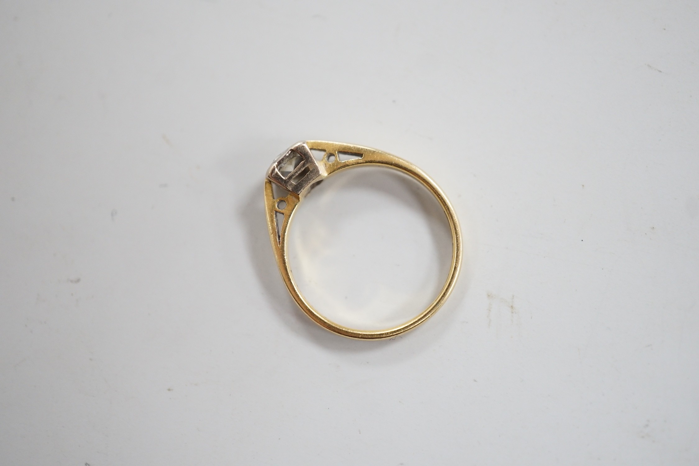 A modern 18ct gold and solitaire diamond ring, size K, gross weight 2.3 grams.